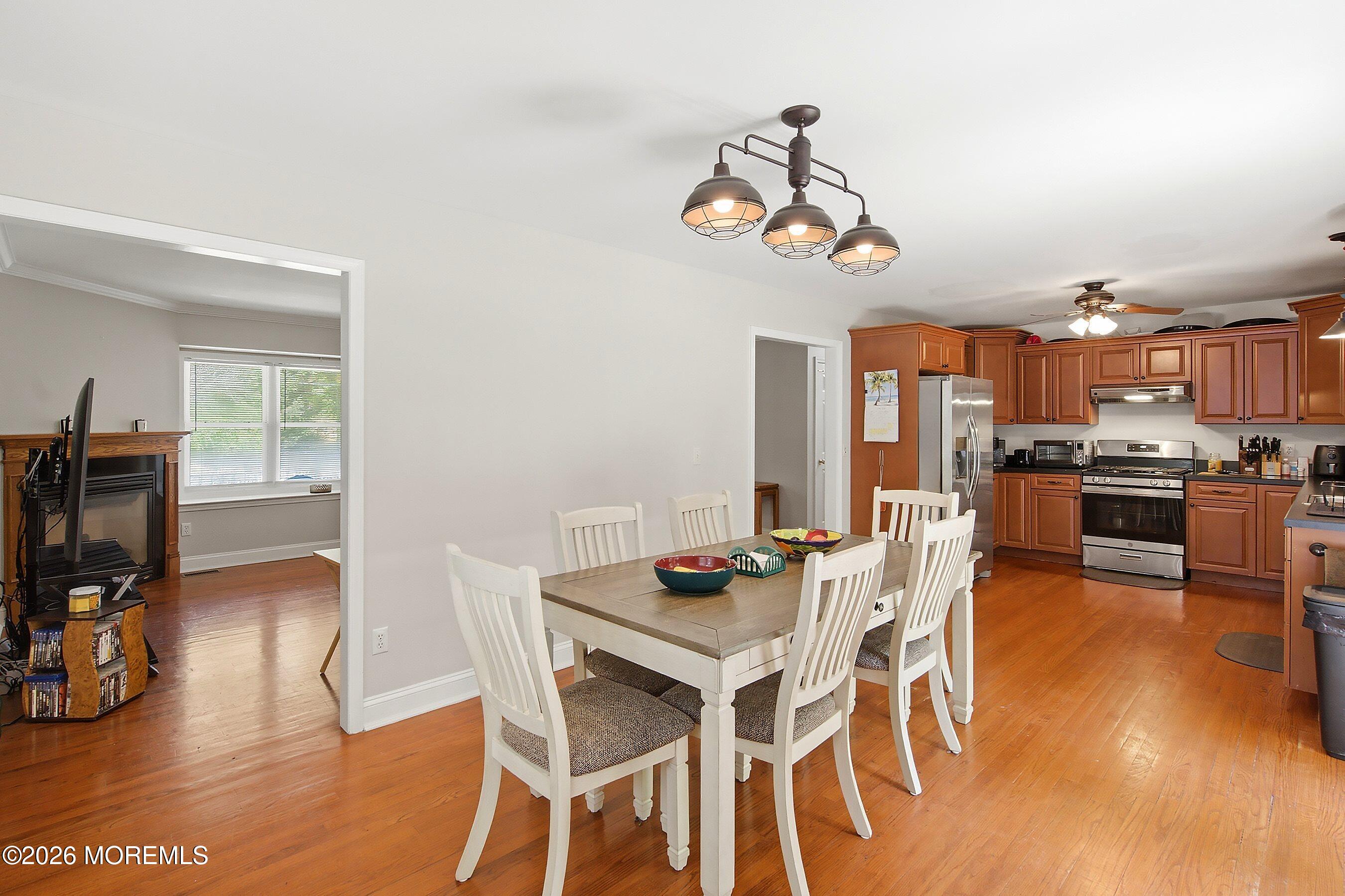 935 Bethel Church Road Jackson, NJ 08527 - Photo 9 of 32 a view of a dining room with furniture wooden floor and a rug