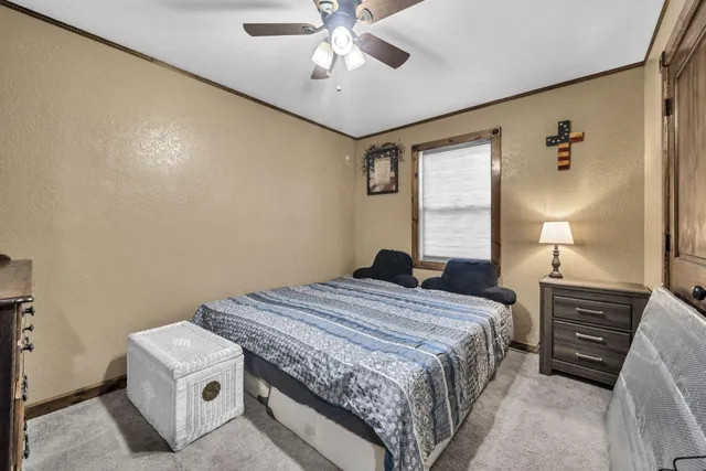 a bedroom with a bed and a dresser