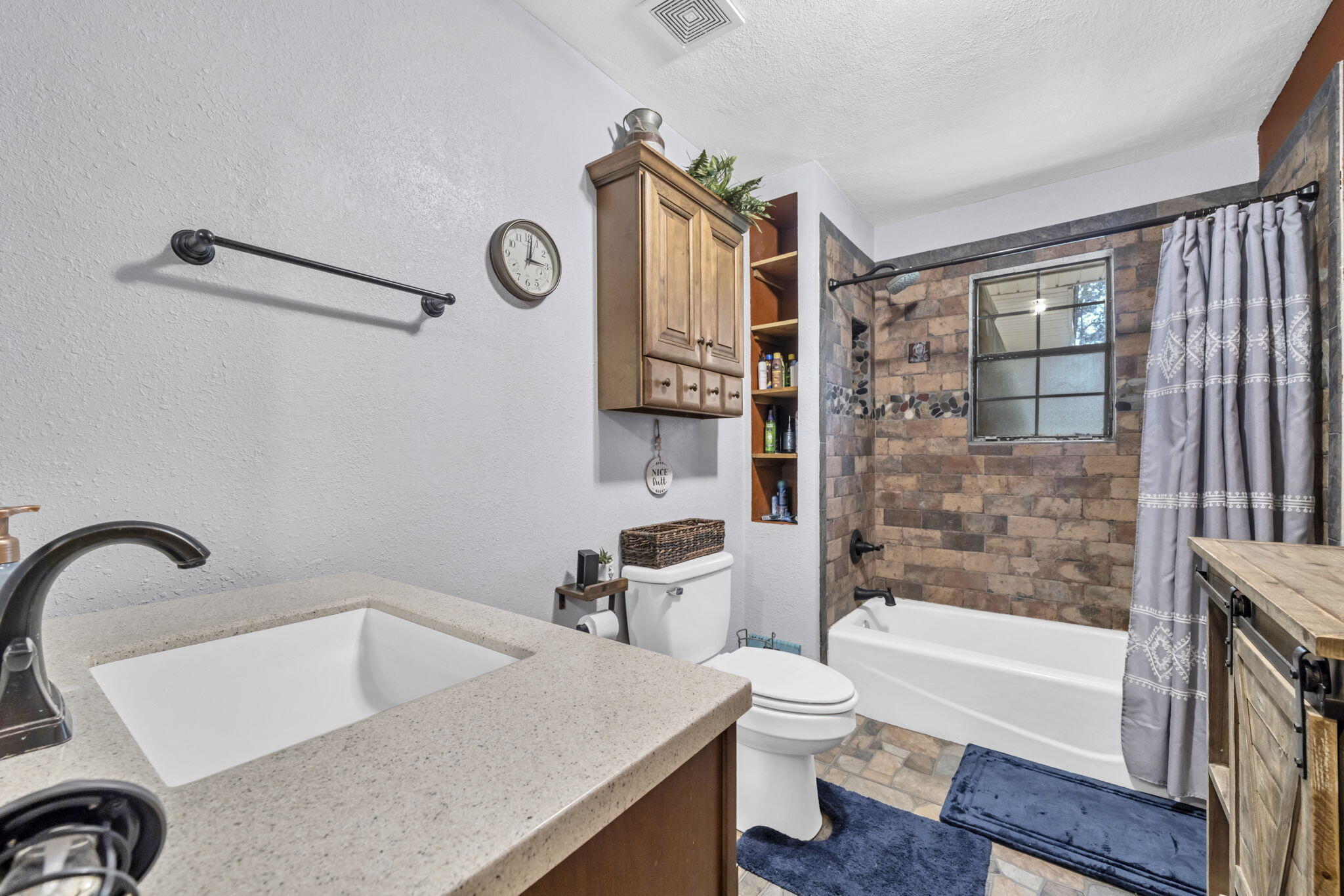 6359 Childrens Lane Crestview, FL 32539 - Photo 22 of 50 a bathroom with a bathtub shower sink mirror and toilet
