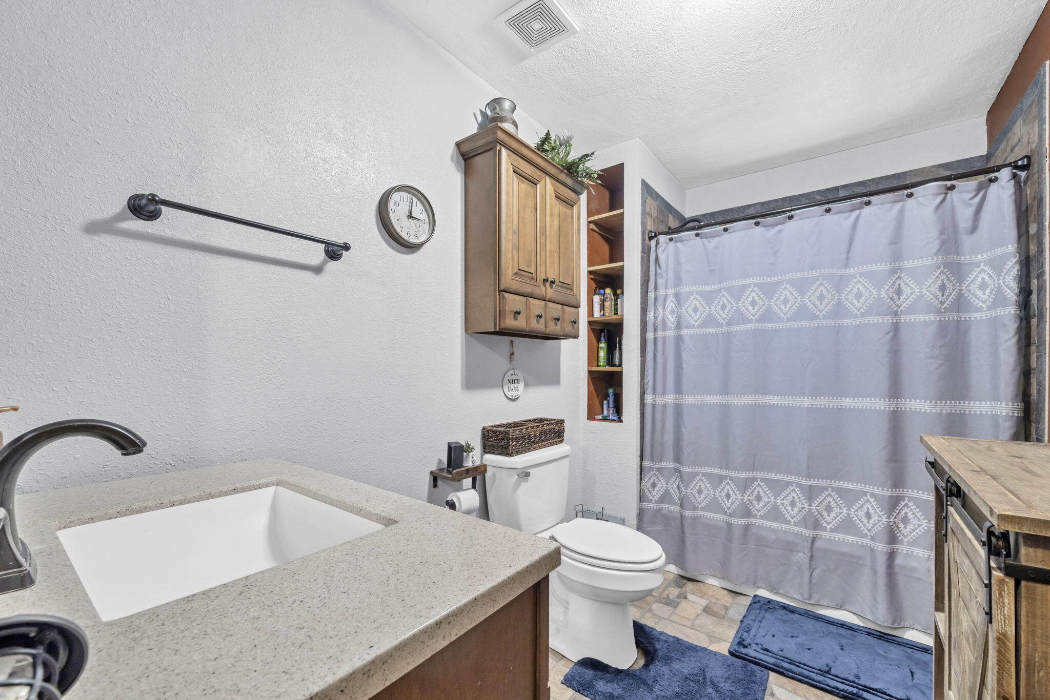 6359 Childrens Lane Crestview, FL 32539 - Photo 23 of 50 a bathroom with a sink a toilet and shower