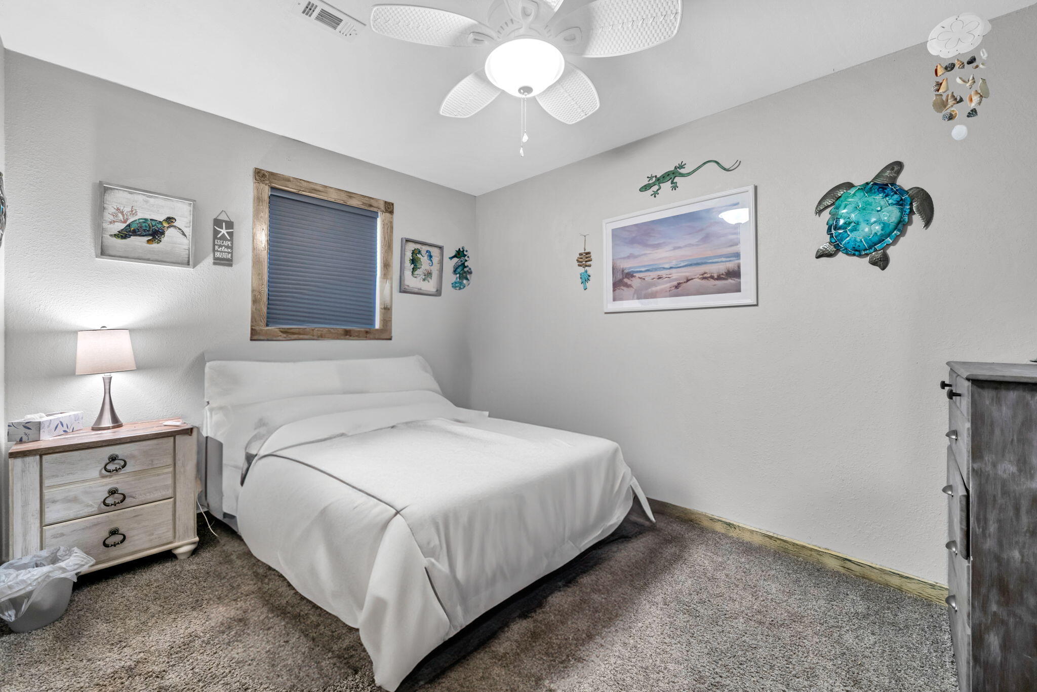 6359 Childrens Lane Crestview, FL 32539 - Photo 24 of 50 a bedroom with a bed and a chandelier