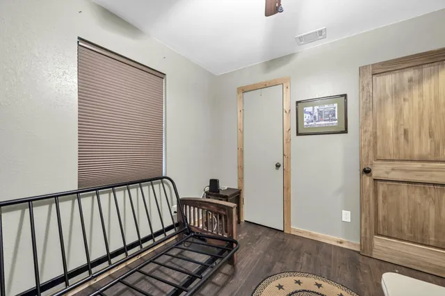 a living room with furniture and a bed