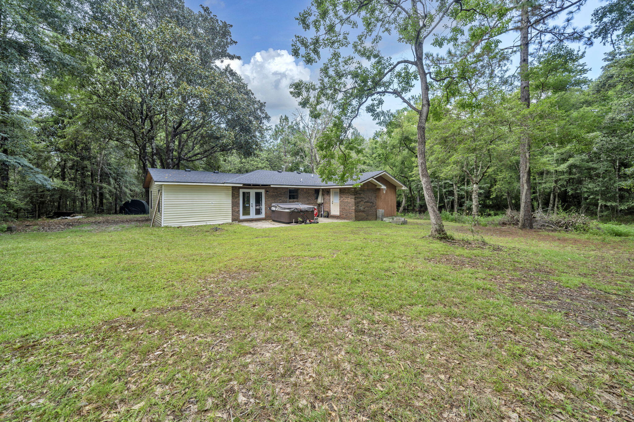 6359 Childrens Lane Crestview, FL 32539 - Photo 10 of 50 a house view with a garden space