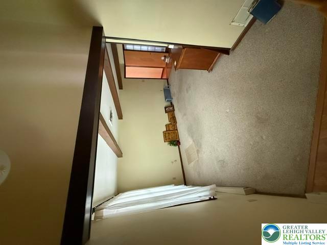 2045 Church Road Bethlehem, PA 18015 - Photo 21 of 42 A well-lit entry hall with plush carpet and structural wood accents welcomes all who enter.