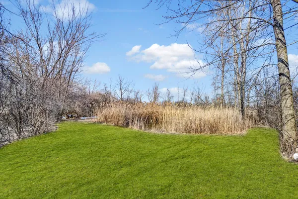 a view of a golf course of a house