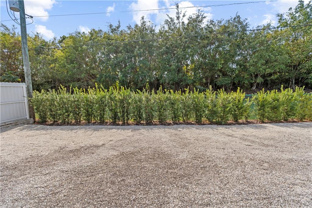 183 7th Street Naples, FL 34113 - Photo 41 of 50 View of backyard completely fenced in