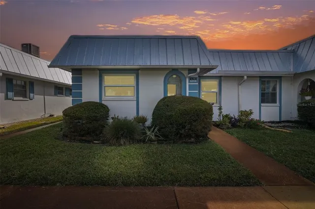 a house view with a garden space