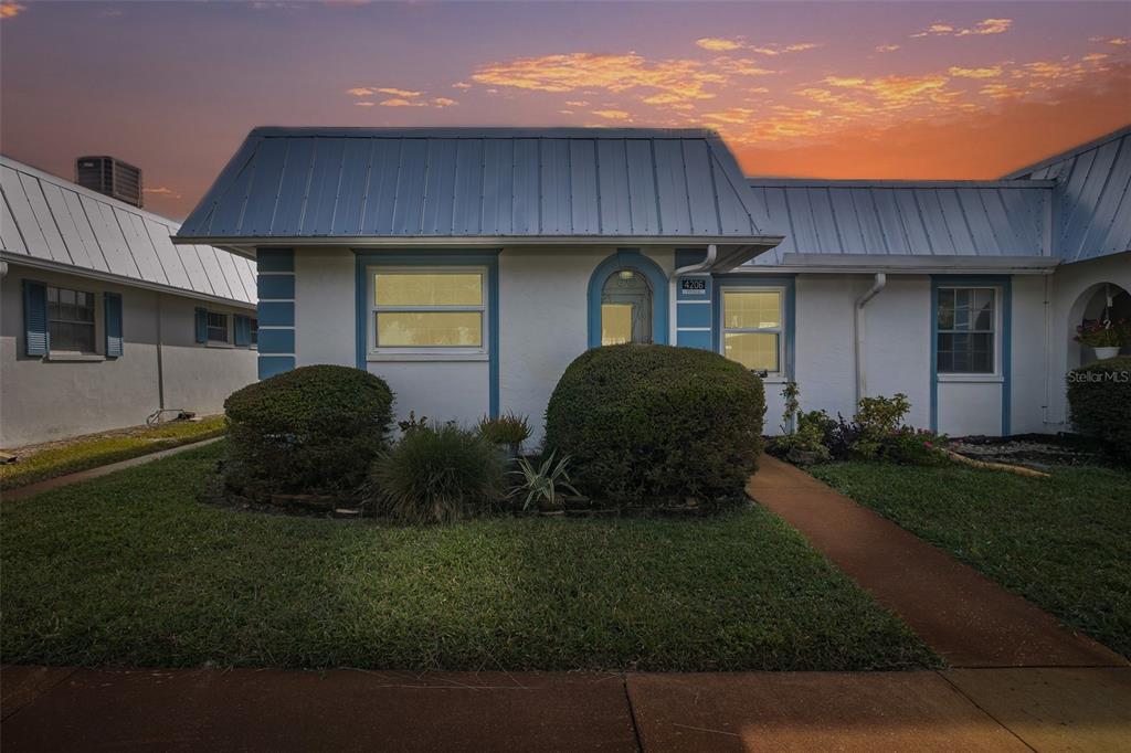 a house view with a garden space