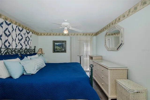 a living room with a bed furniture and a chandelier