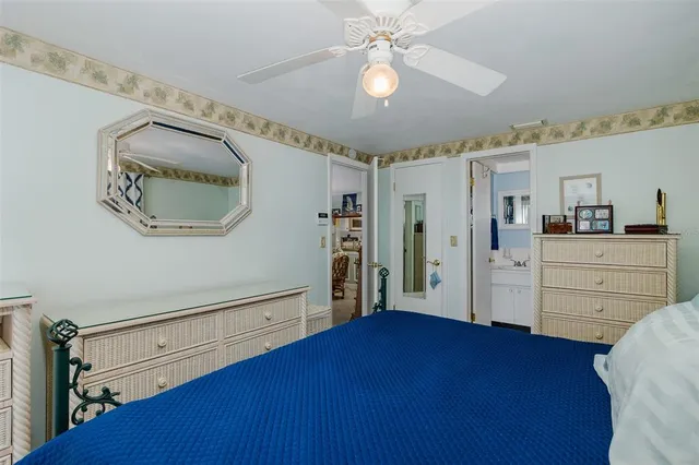 a bathroom with a toilet sink a mirror and vanity