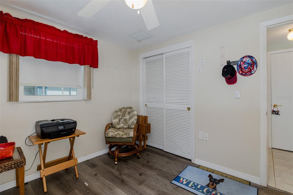 4206 Richmere Drive, Unit 3 New Port Richey, FL 34652 - Photo 29 of 41 a view of a workspace with furniture and wooden floor