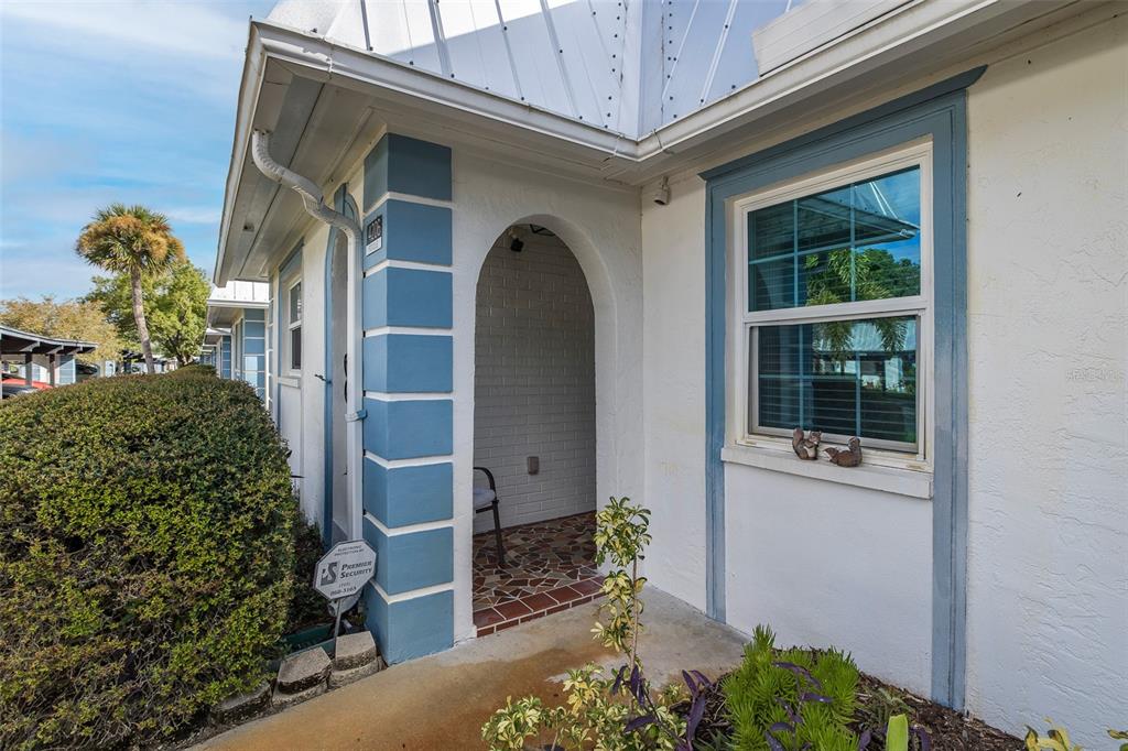 4206 Richmere Drive, Unit 3 New Port Richey, FL 34652 - Photo 4 of 41 a front view of a house with a garden