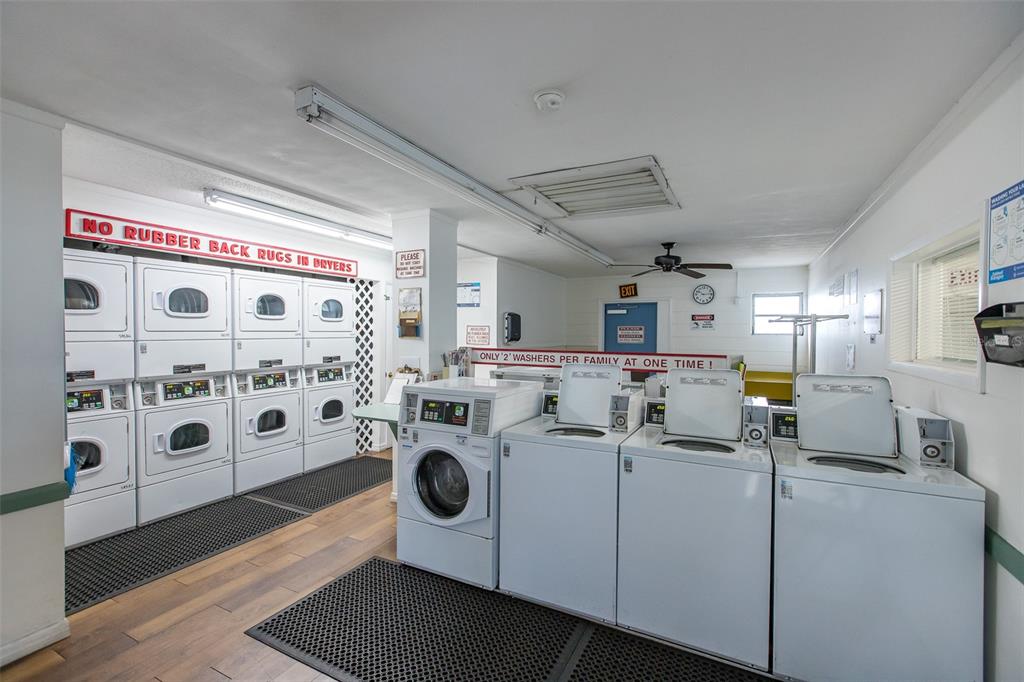 4206 Richmere Drive, Unit 3 New Port Richey, FL 34652 - Photo 41 of 41 a utility room with multiple dryer and washer