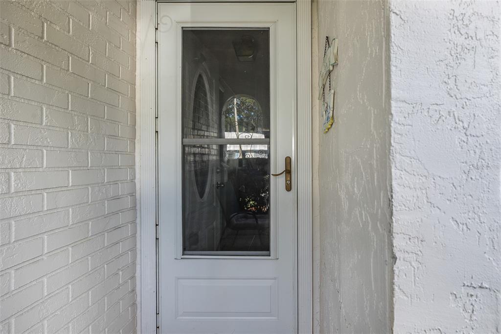 4206 Richmere Drive, Unit 3 New Port Richey, FL 34652 - Photo 6 of 41 a view of a bathroom that has a glass door and shower