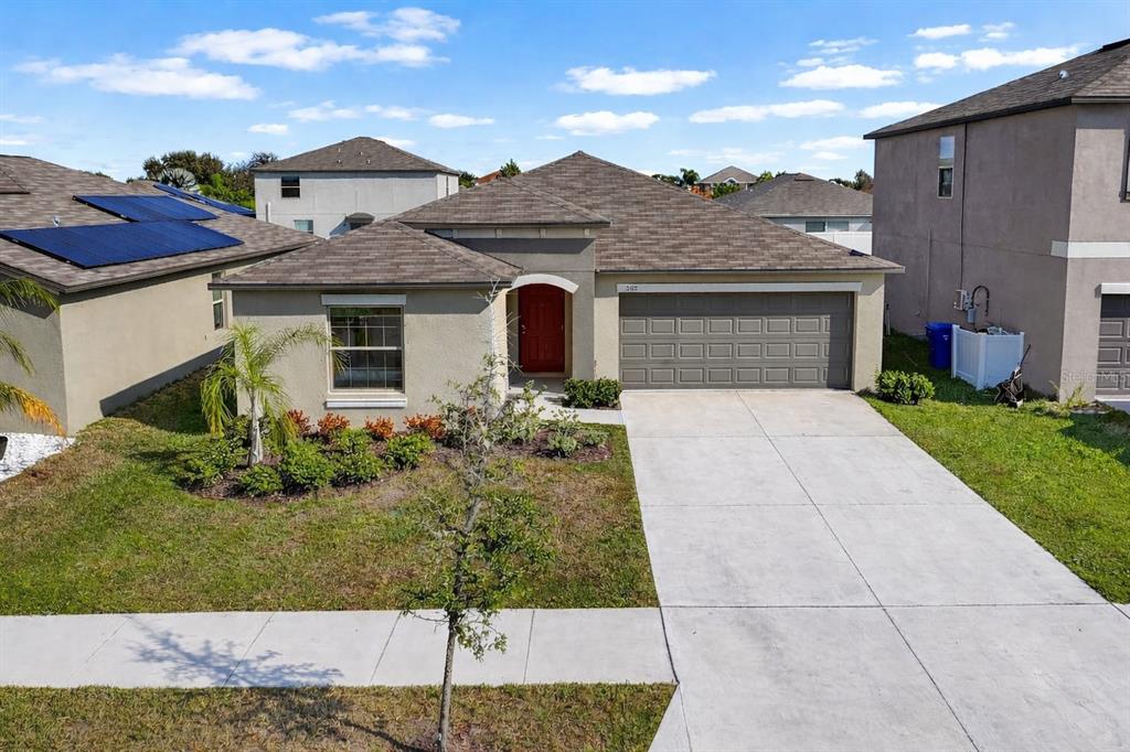 889 Calico Scallop Street Ruskin, FL 33570 - Photo 1 of 32 front view of house with a yard