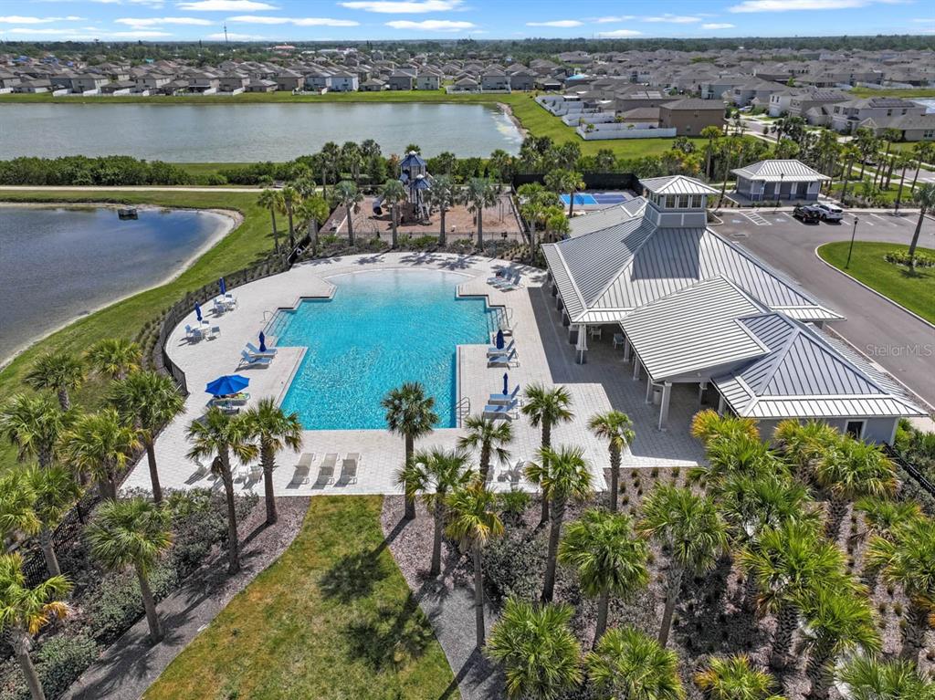889 Calico Scallop Street Ruskin, FL 33570 - Photo 22 of 32 an aerial view of a house with a lake view