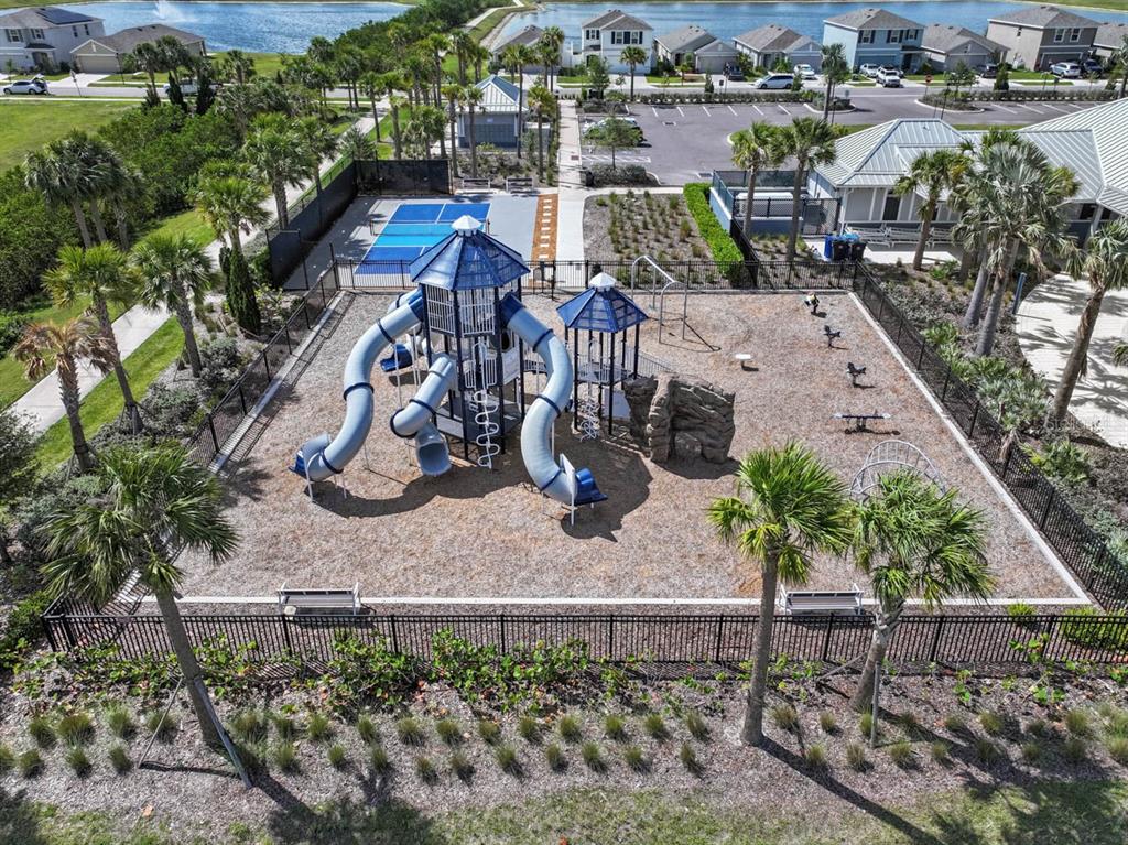889 Calico Scallop Street Ruskin, FL 33570 - Photo 24 of 32 an aerial view of a house with garden space and street view