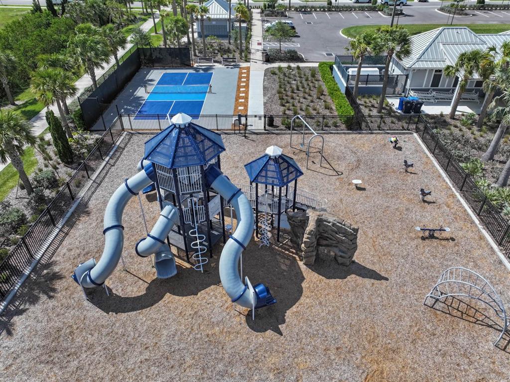 889 Calico Scallop Street Ruskin, FL 33570 - Photo 25 of 32 an aerial view of a backyard with seating space