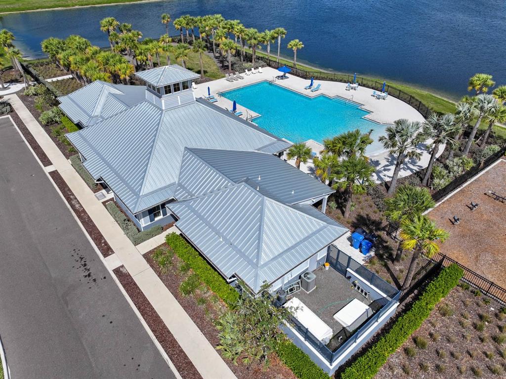 889 Calico Scallop Street Ruskin, FL 33570 - Photo 27 of 32 an aerial view of a house with a yard