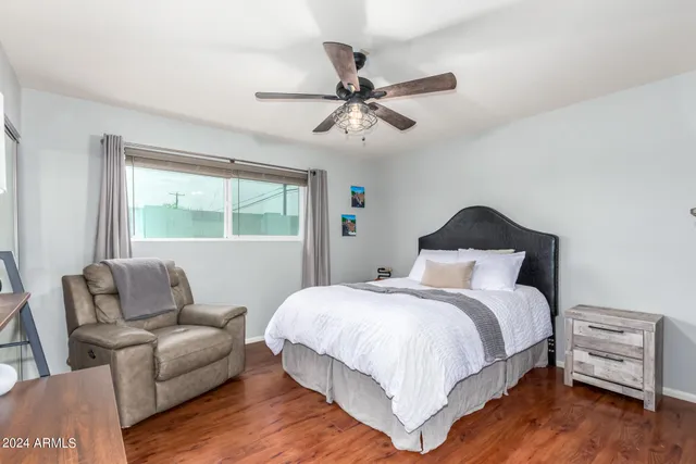 a bedroom with a bed and a couch