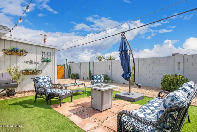 a view of a house with wooden fence
