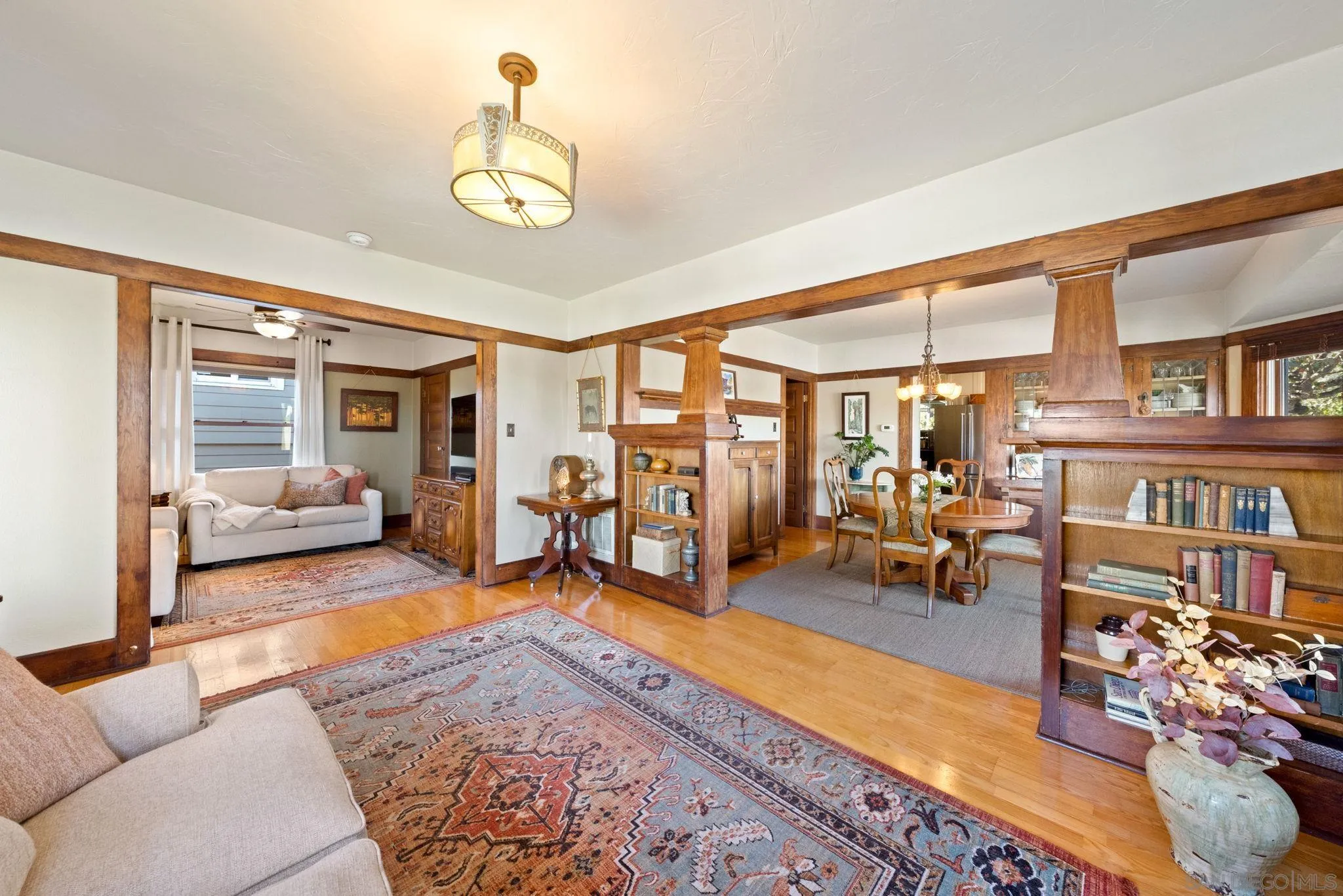 4536 Nebo Drive La Mesa, CA 91941 - Photo 11 of 58 a living room with furniture a rug and a chandelier