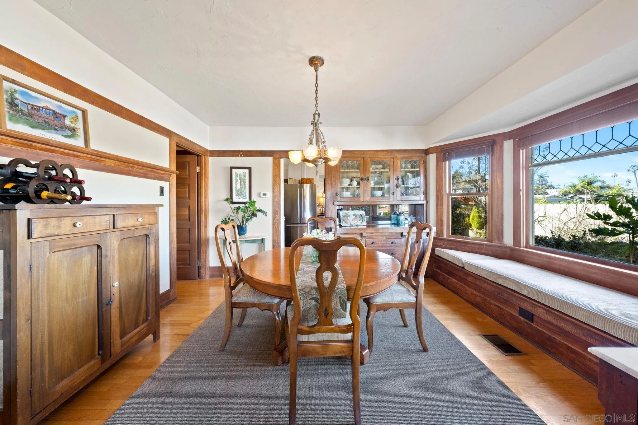 4536 Nebo Drive La Mesa, CA 91941 - Photo 15 of 58 a dining room with furniture a chandelier and wooden floor