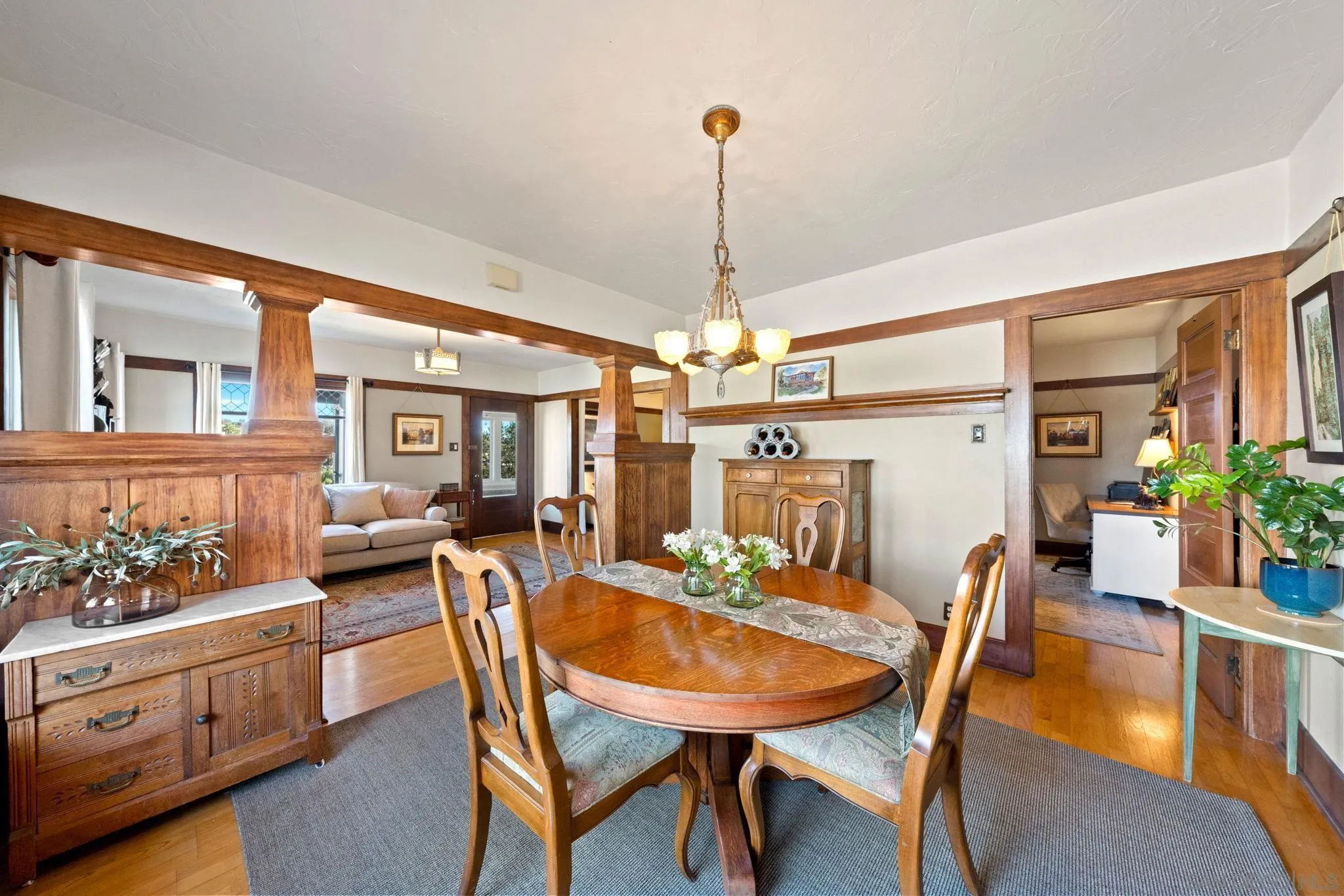 4536 Nebo Drive La Mesa, CA 91941 - Photo 17 of 58 a view of a dining room and livingroom with furniture wooden floor a chandelier