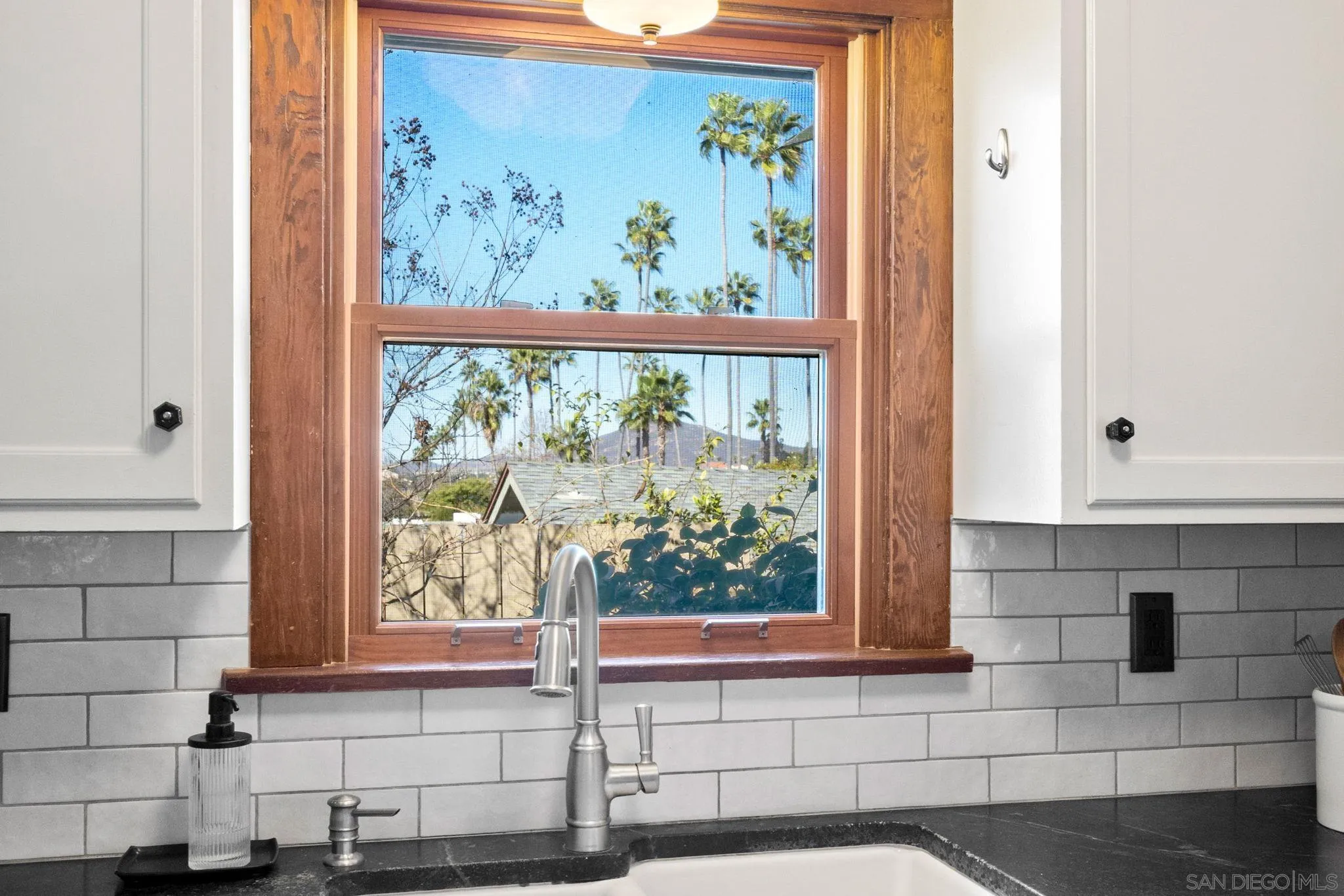 4536 Nebo Drive La Mesa, CA 91941 - Photo 23 of 58 a bathroom with a window and a mirror