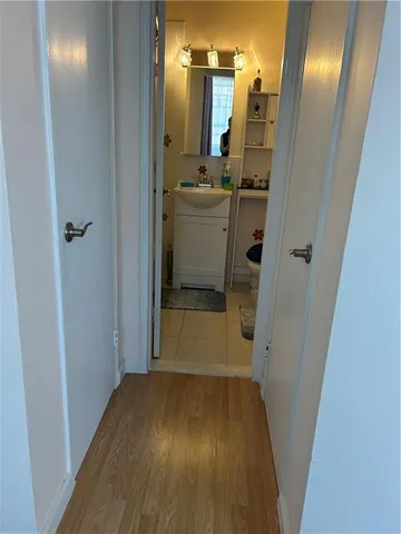 a bathroom with a sink and mirror