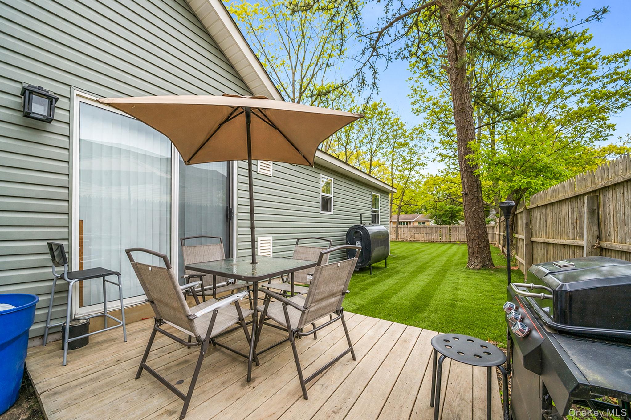 332 Commack Road Shirley, NY 11967 - Photo 20 of 25 a view of a backyard with sitting area