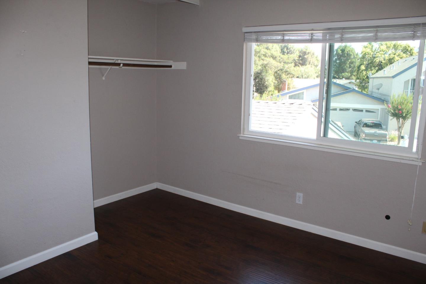 1025 Fillippelli Drive Gilroy, CA 95020 - Photo 17 of 47 a view of a small space with wooden floor and a window