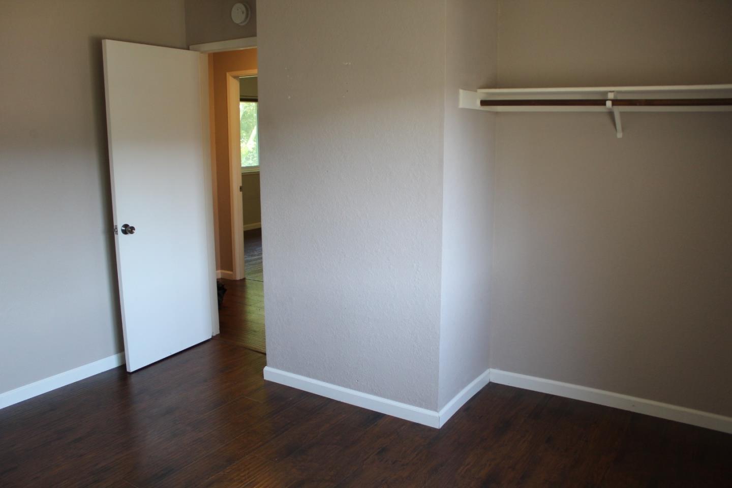 1025 Fillippelli Drive Gilroy, CA 95020 - Photo 18 of 47 a view of an empty room with wooden floor