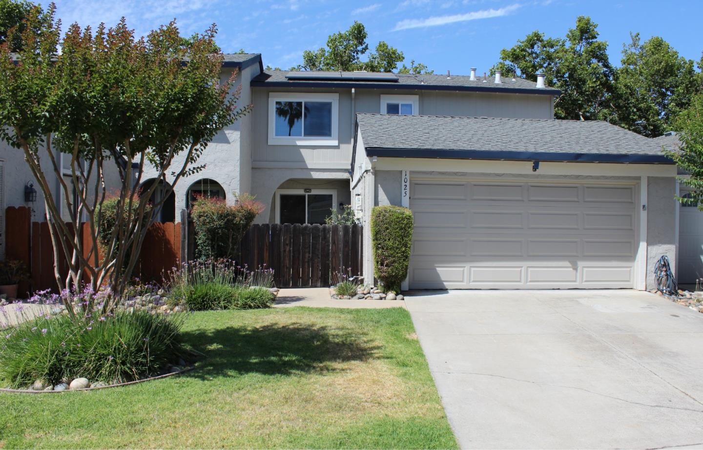 1025 Fillippelli Drive Gilroy, CA 95020 - Photo 2 of 47 a front view of a house with a yard and garage