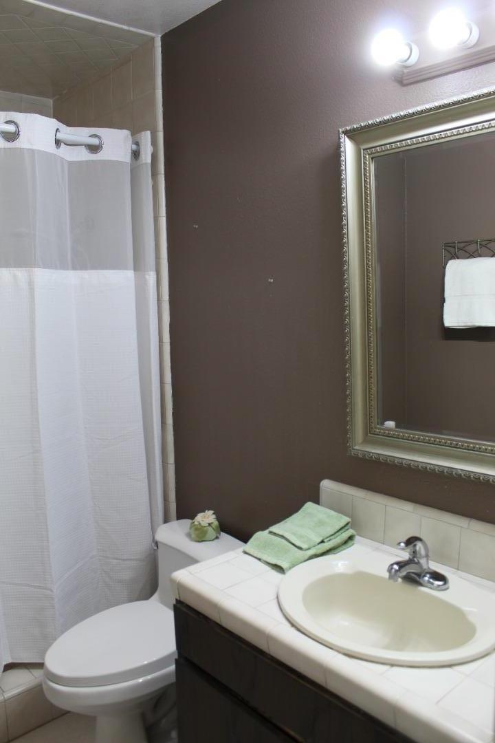 1025 Fillippelli Drive Gilroy, CA 95020 - Photo 30 of 47 a bathroom with a sink toilet and mirror