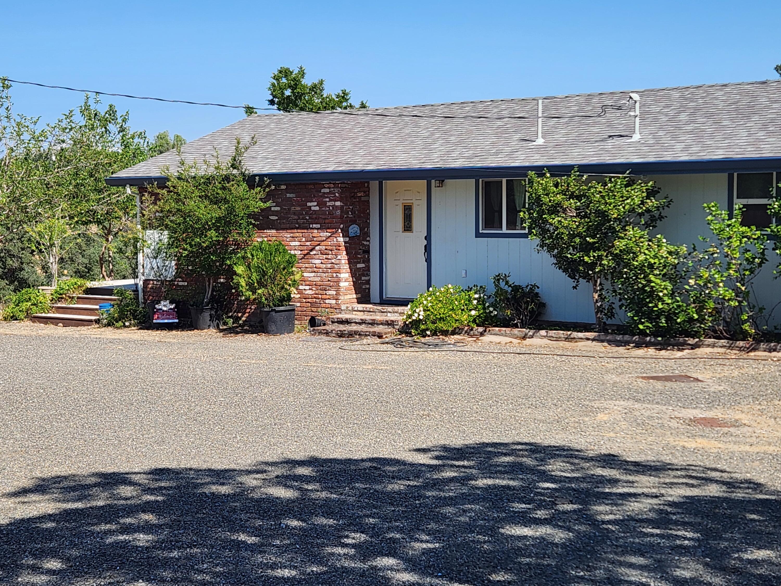 24327 Bascom Road Millville, CA 96062 - Photo 2 of 13 front view of a house with a street