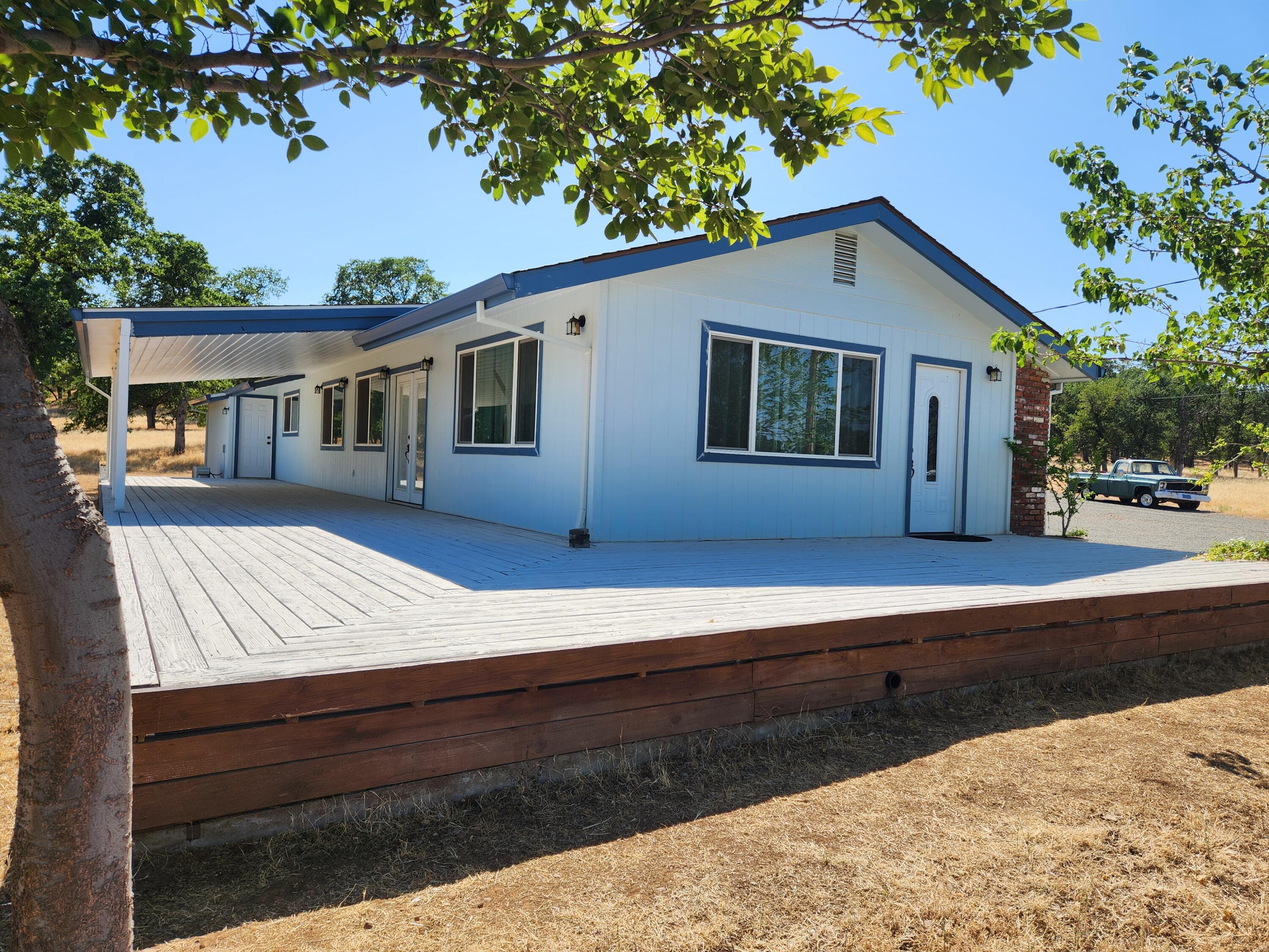 24327 Bascom Road Millville, CA 96062 - Photo 3 of 13 a view of a house with a yard