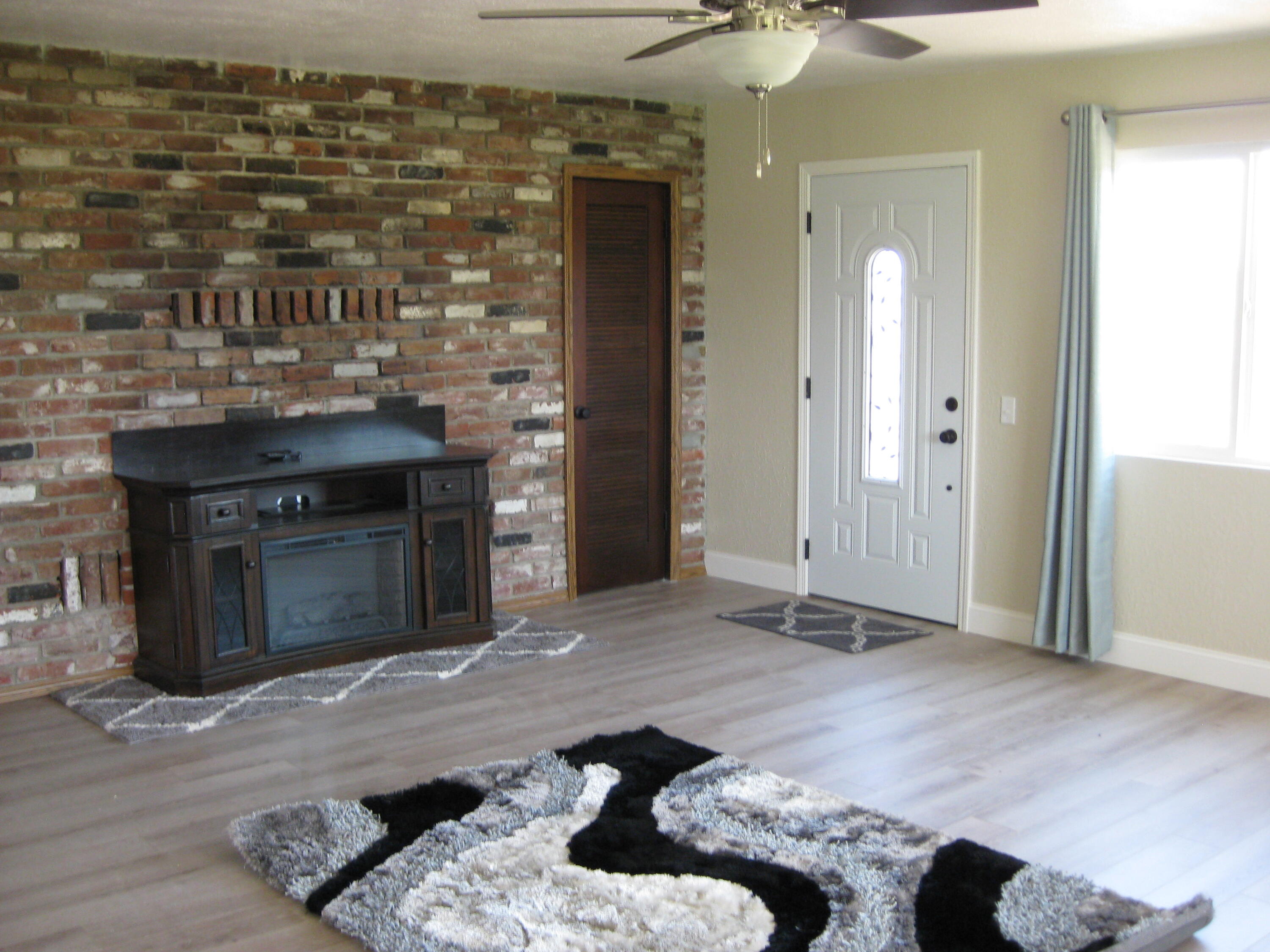 24327 Bascom Road Millville, CA 96062 - Photo 7 of 13 a living room with furniture and a fireplace