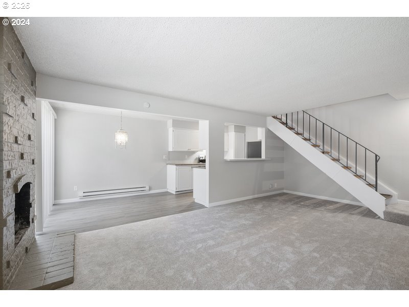 2921 Northeast Rene Avenue, Unit 15B Gresham, OR 97030 - Photo 12 of 22 a view of an empty room with a fireplace