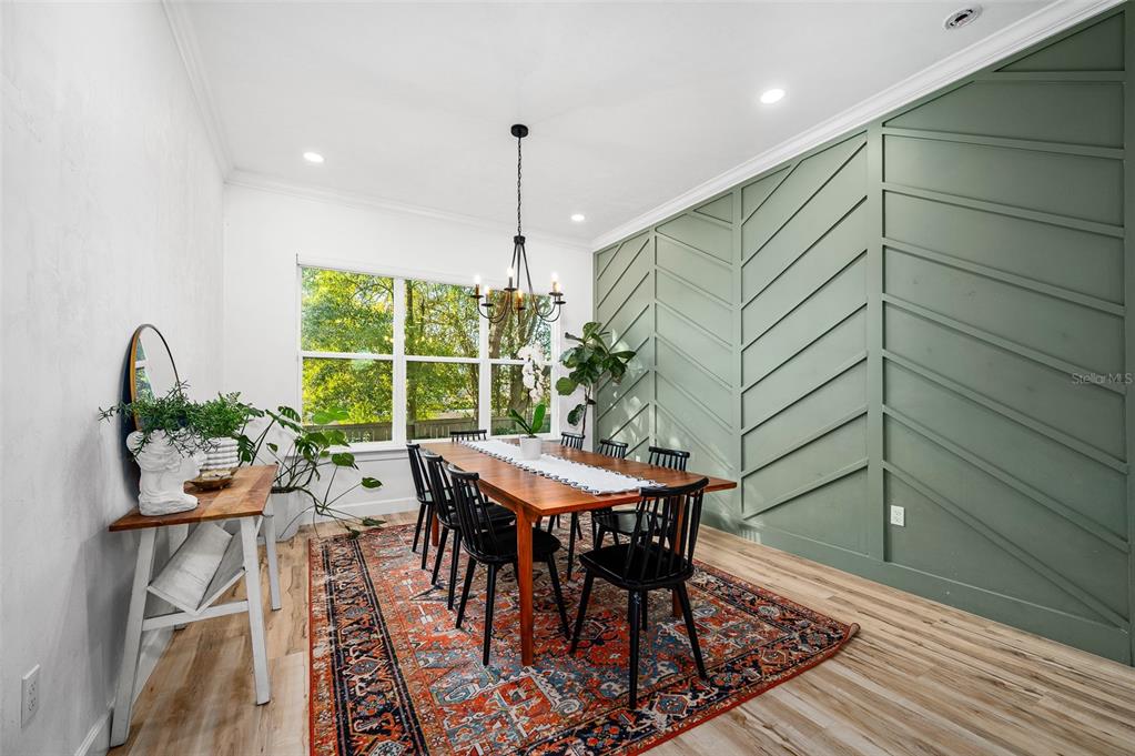 1068 Southwest 120th Drive Gainesville, FL 32607 - Photo 18 of 43 a view of a dining room with furniture window and outside view
