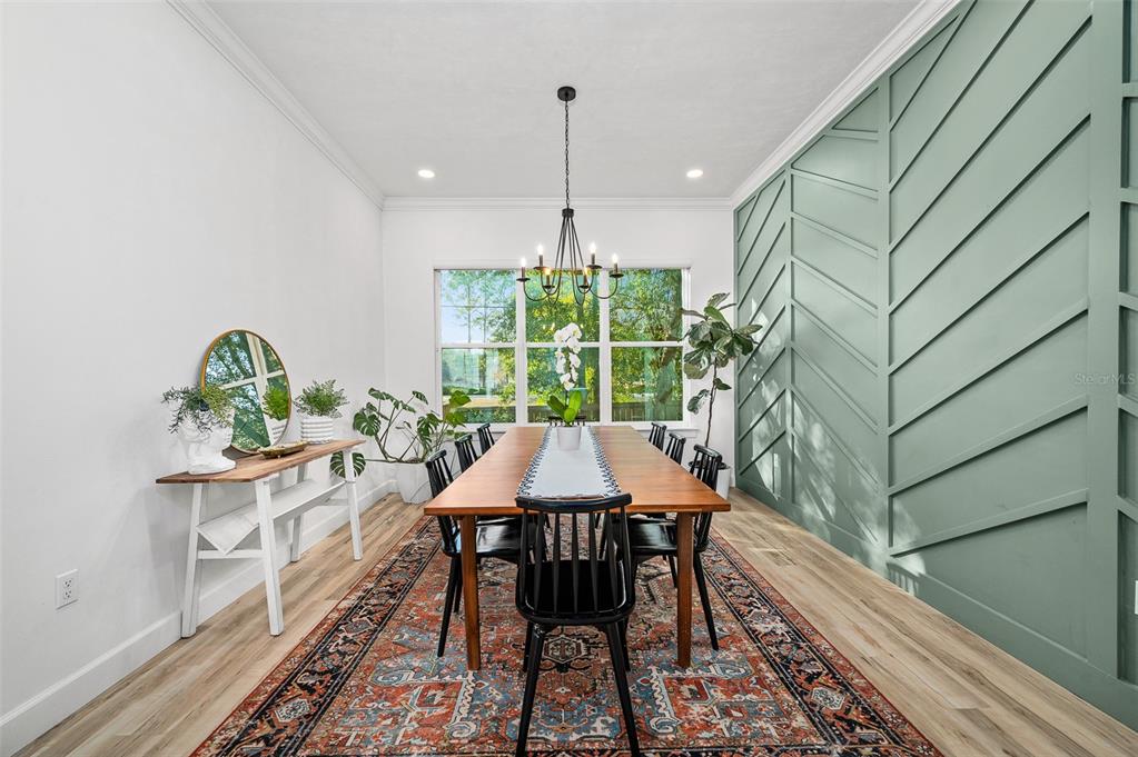 1068 Southwest 120th Drive Gainesville, FL 32607 - Photo 19 of 43 a view of a dining room with furniture window and wooden floor