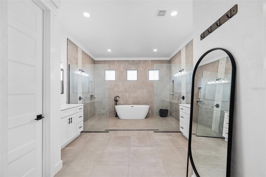 1068 Southwest 120th Drive Gainesville, FL 32607 - Photo 23 of 43 a bathroom with a tub and shower