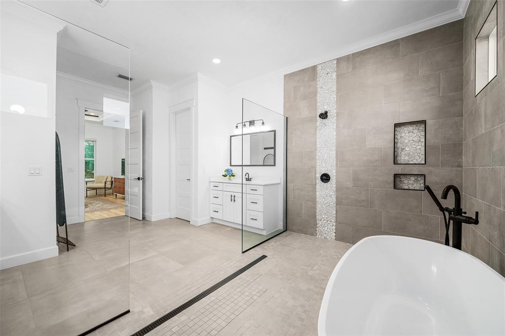 1068 Southwest 120th Drive Gainesville, FL 32607 - Photo 26 of 43 a spacious bathroom with a sink and a tub