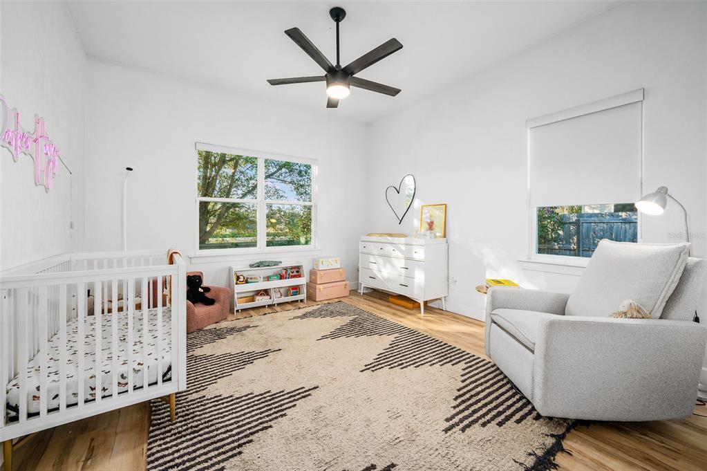 1068 Southwest 120th Drive Gainesville, FL 32607 - Photo 32 of 43 a living room with furniture and a large window