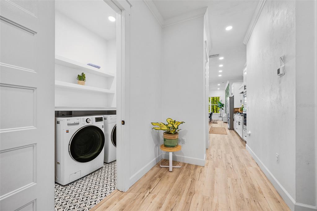 1068 Southwest 120th Drive Gainesville, FL 32607 - Photo 34 of 43 a hallway with a washer and dryer