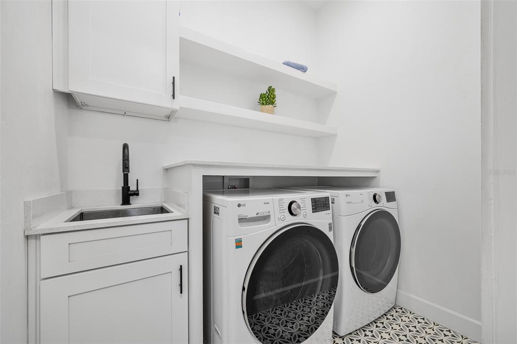1068 Southwest 120th Drive Gainesville, FL 32607 - Photo 35 of 43 a utility room with dryer and washer