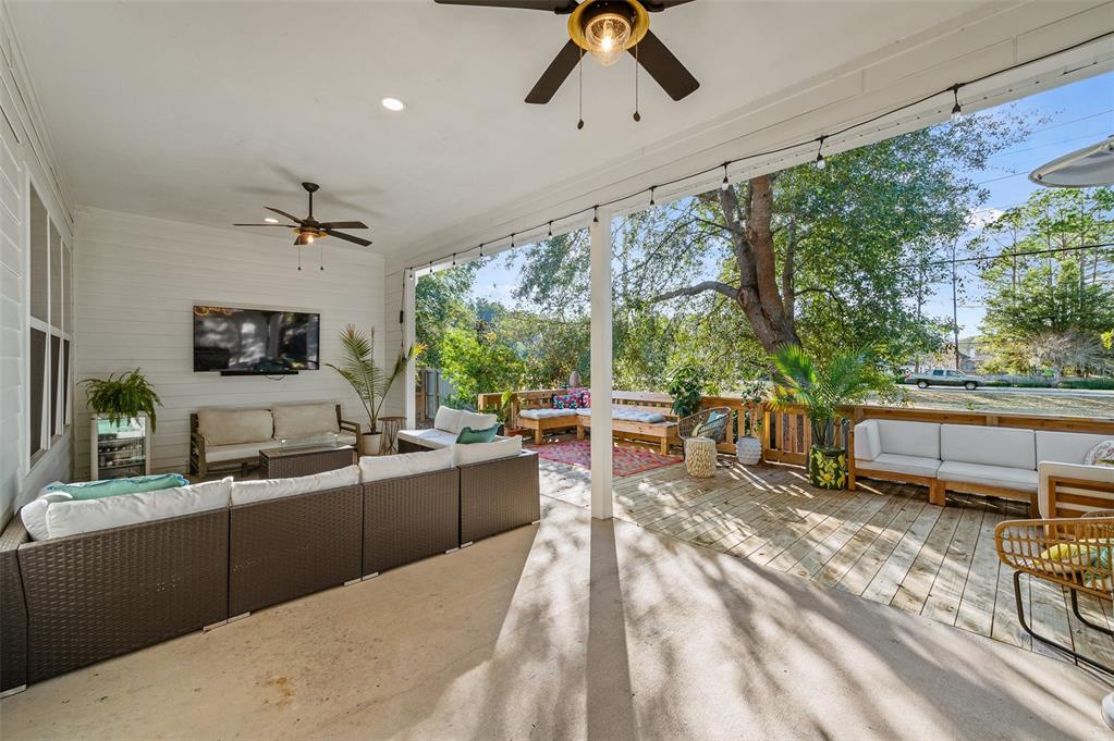 1068 Southwest 120th Drive Gainesville, FL 32607 - Photo 36 of 43 a living room with furniture and a large window