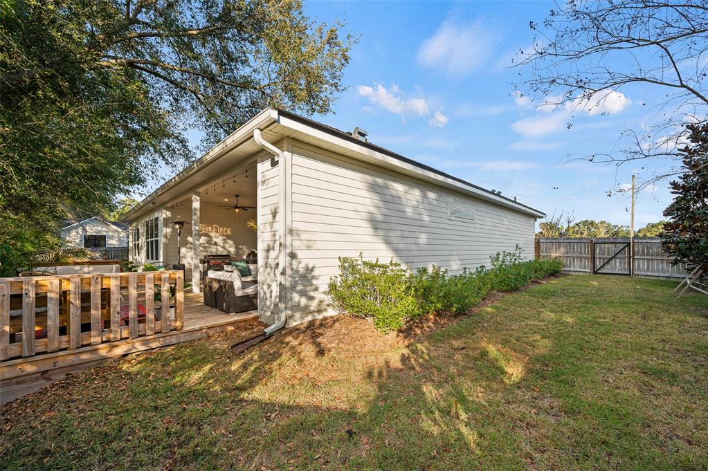 1068 Southwest 120th Drive Gainesville, FL 32607 - Photo 42 of 43 a view of backyard with outdoor seating and green space