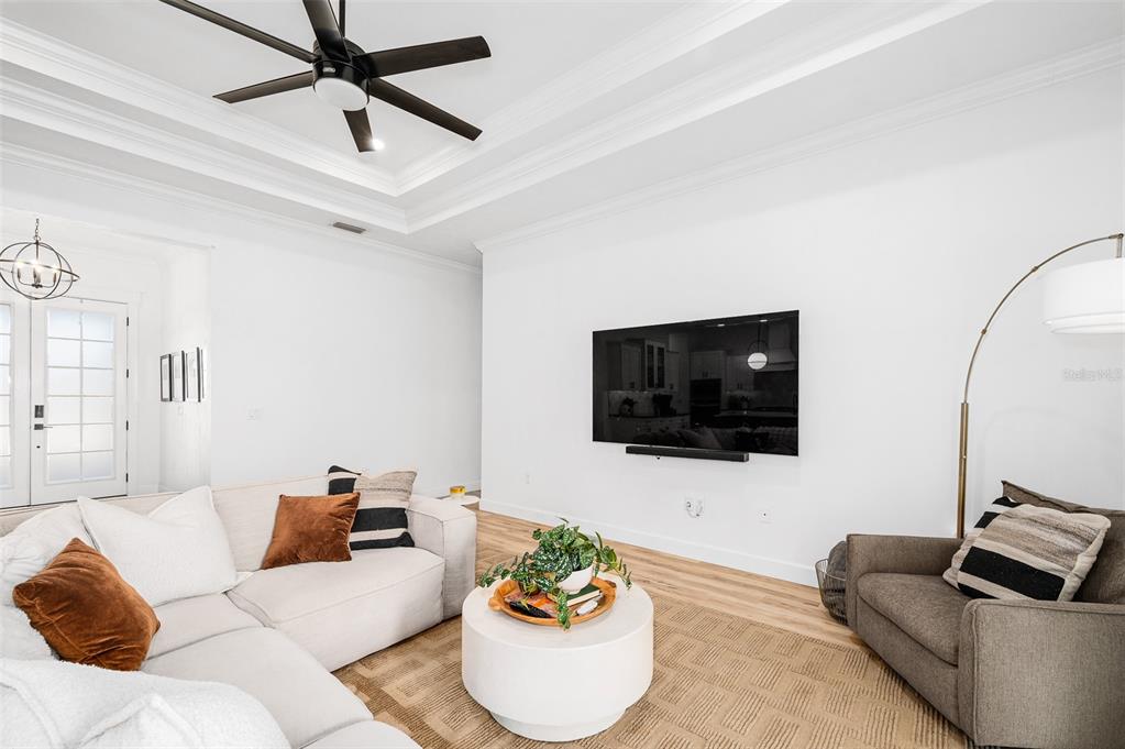 1068 Southwest 120th Drive Gainesville, FL 32607 - Photo 7 of 43 a living room with furniture and a flat screen tv