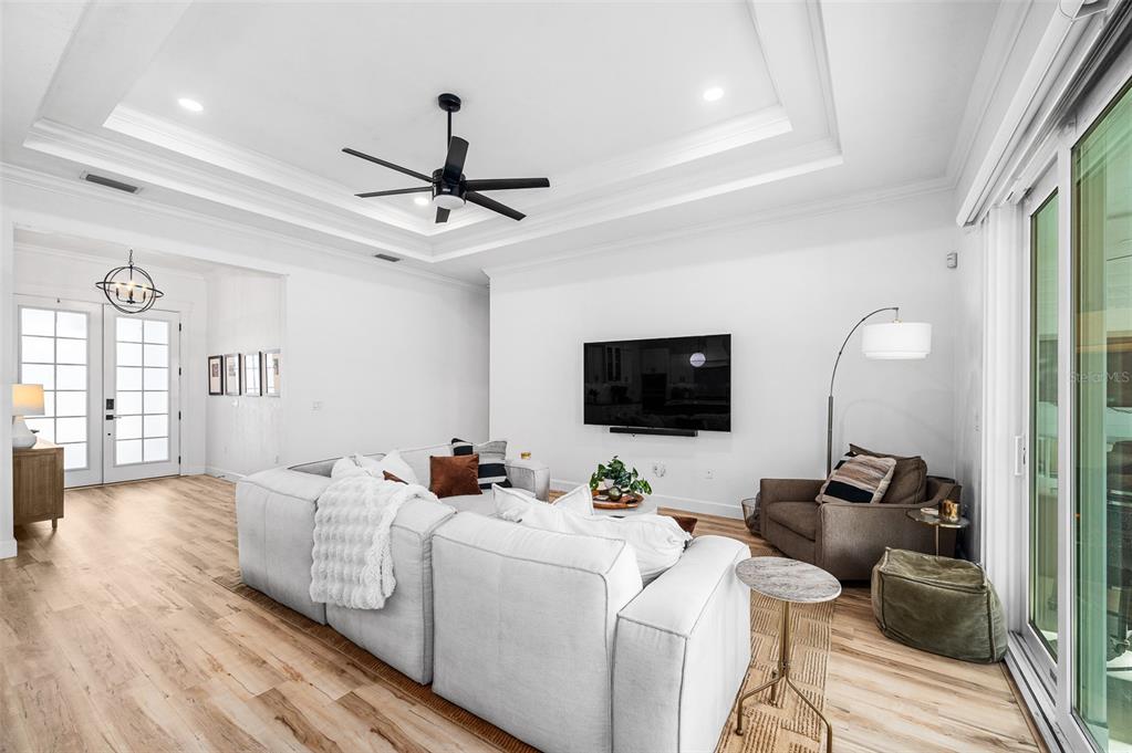1068 Southwest 120th Drive Gainesville, FL 32607 - Photo 8 of 43 a living room with furniture a flat screen tv and a window